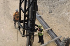 August 2021 - A pile driver is set up to drive another I-beam pile to support the embankment for construction of the northern abutment of the new bridge over Neshaminy Creek.